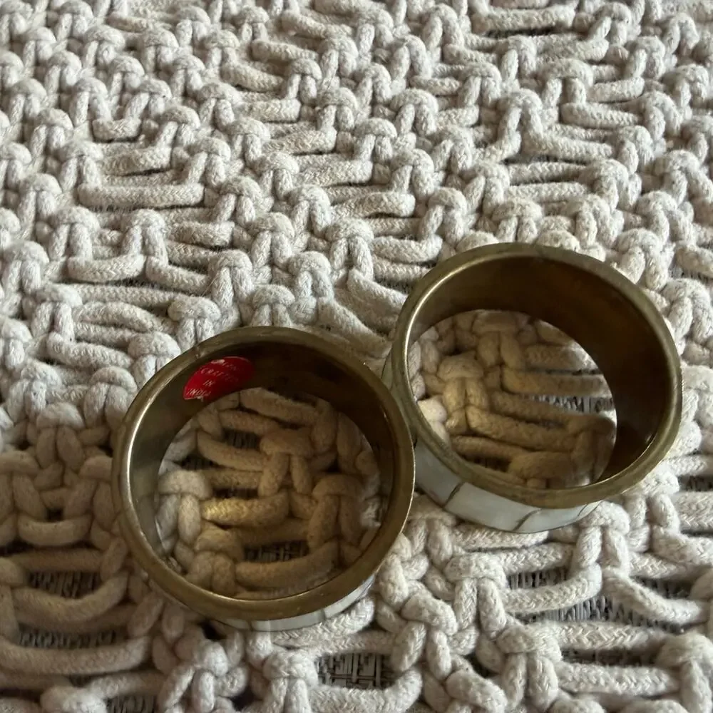 Two brass and (abalone) mother of pearl napkin rings